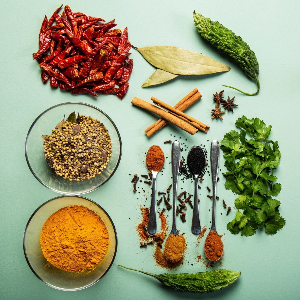 Empire Masale Garam Masala Blend 200g pouch with bowl of garam masala powder on neutral background