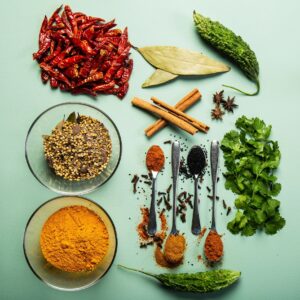 Empire Masale Garam Masala Blend 200g pouch with bowl of garam masala powder on neutral background