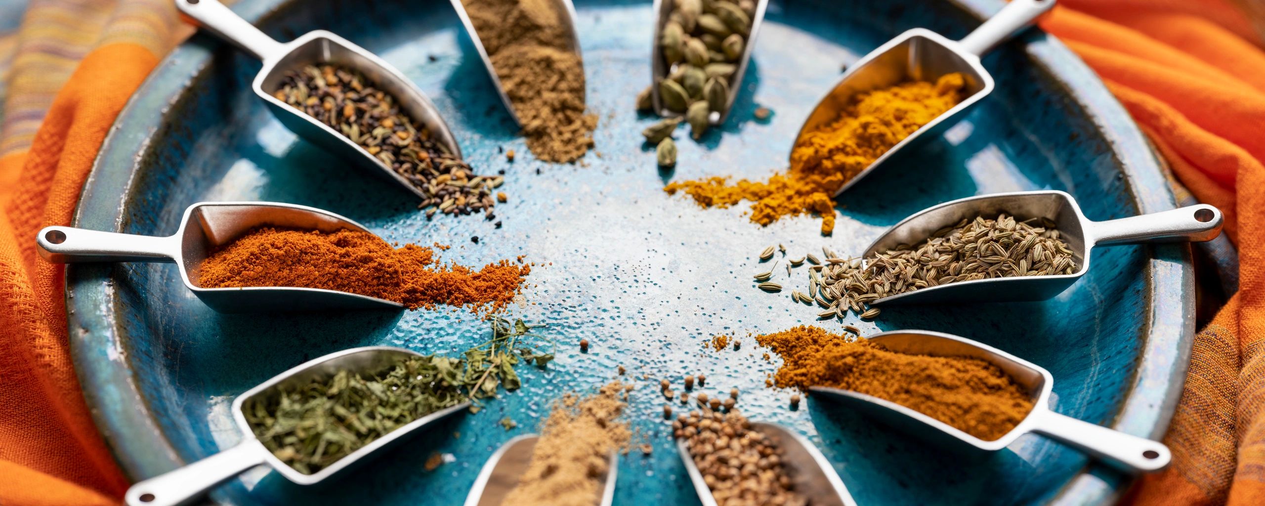 Colorful assortment of spices in scoops